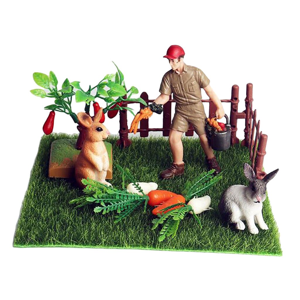 Miniatur-mikrolandschaftsdekoration mit kaninchen und karotten (nahaufnahme)