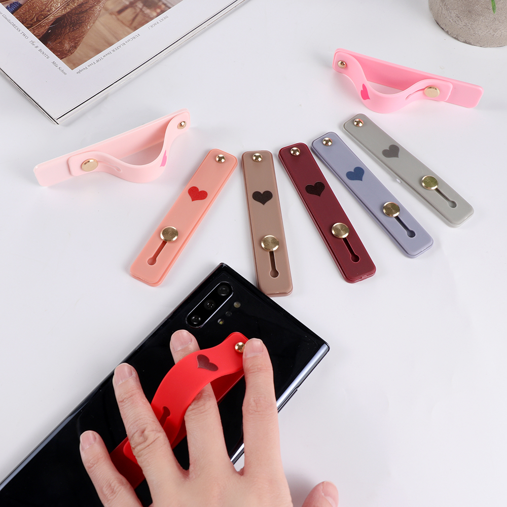 1pc uniwersalny silikonowy uchwyt na telefon palec serdeczny pasek na nadgarstek Push Pull Grip Stretch stojak serce cukierki kolor opaska na rękę uchwyt