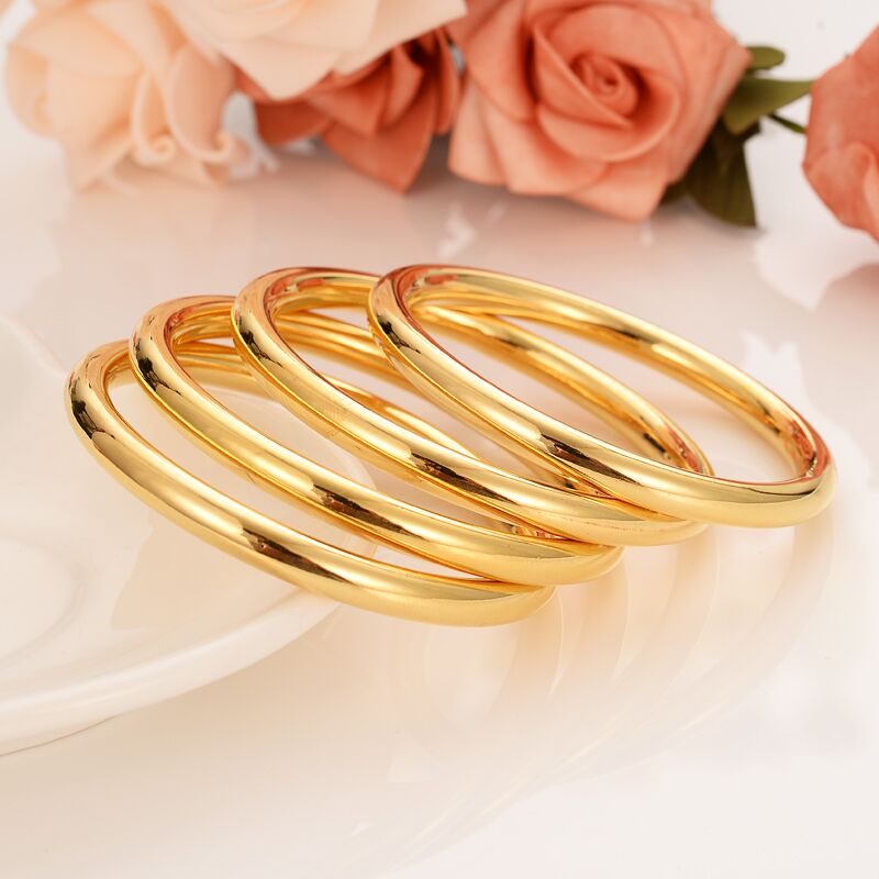 4- teiliges set aus dubai-glasur-armreifen, 24 k feine gold-gf-dubai-armbänder, afrikanisch-arabische artikel