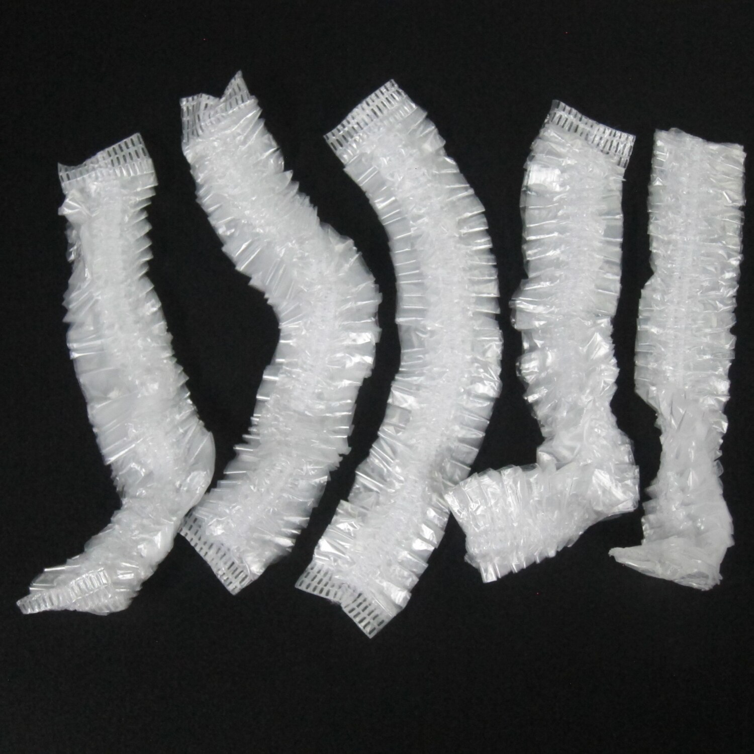 Bonnet de douche jetable en plastique, 100 pièces, pour femmes et hommes, imperméable, transparent, pour salon de coiffure, pour hôtels, produits de salle de bains