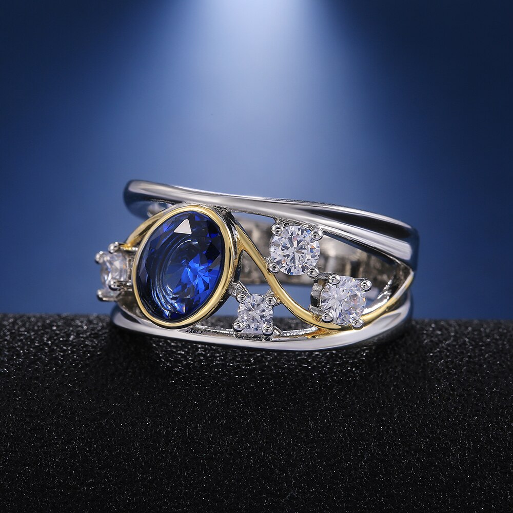 Huitan WunderschöNe Aushöhlen Frauen Finger Ring Oval Blau CZ Stein blendend Hochzeit Braut Ring Tanzen Party Zubehör