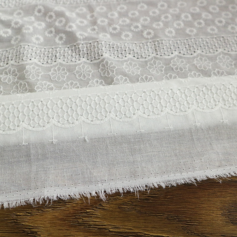 Bomull ren vit genombruten spets brudklänning tyg broderat tyg broderat tyg tyg klänning tyg bomullstyg