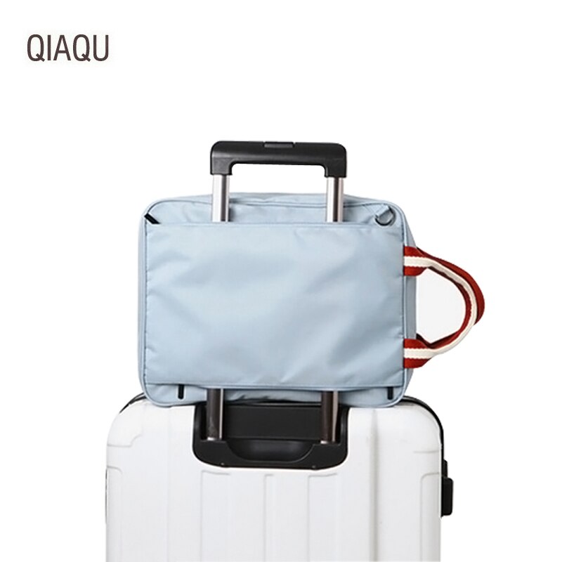 Qiaqutravel alta capacidade de embarque packageman feminino casual cor sólida náilon bolsa de armazenamento de roupas corpo cruz bolsa