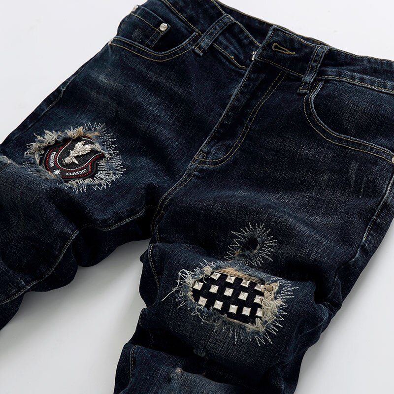 Pantalones vaqueros elásticos ajustados para hombre, Jeans rasgados desgastados negros con remaches, Jeans ajustados de Hip Hop para club nocturno