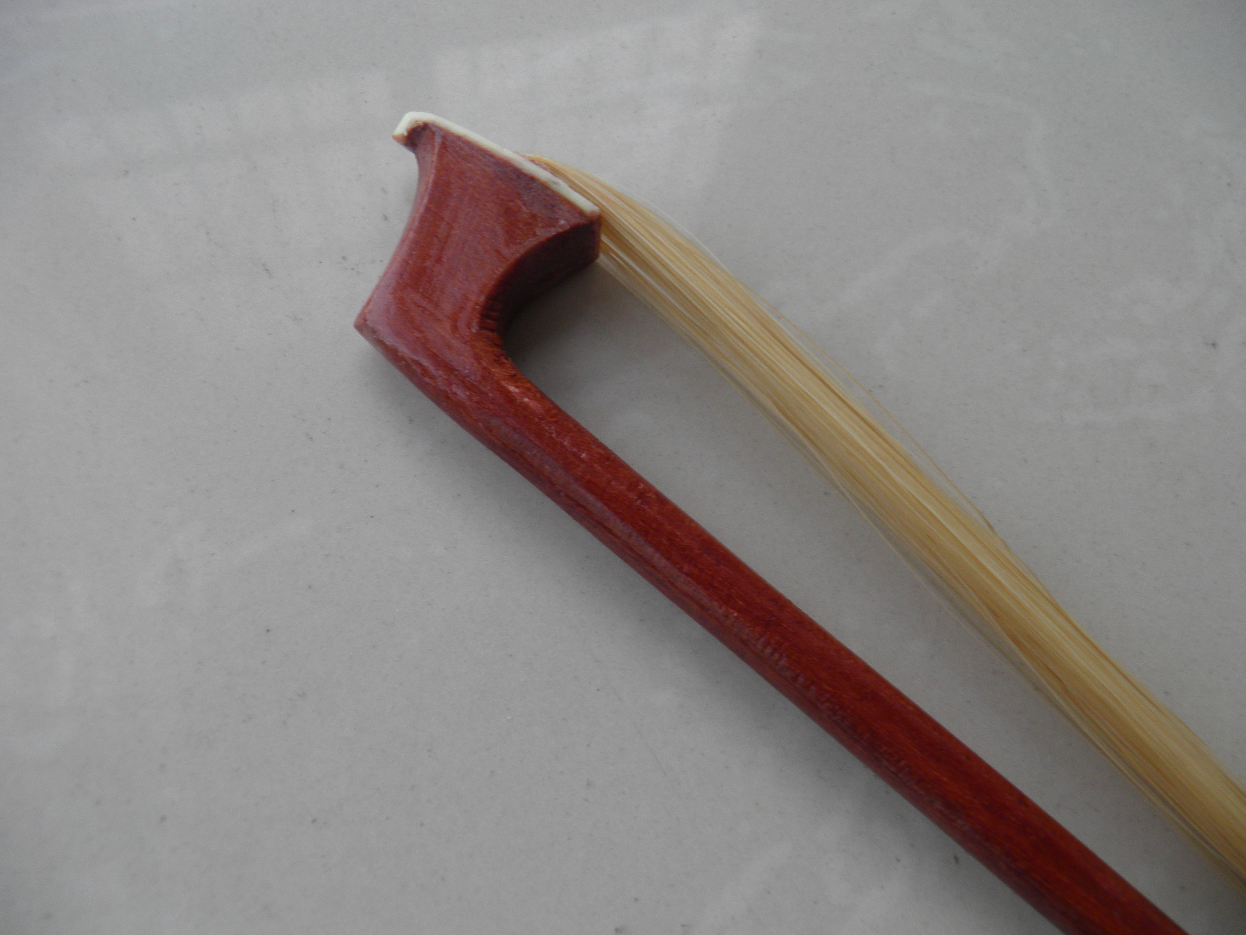 brown wooden cello bow