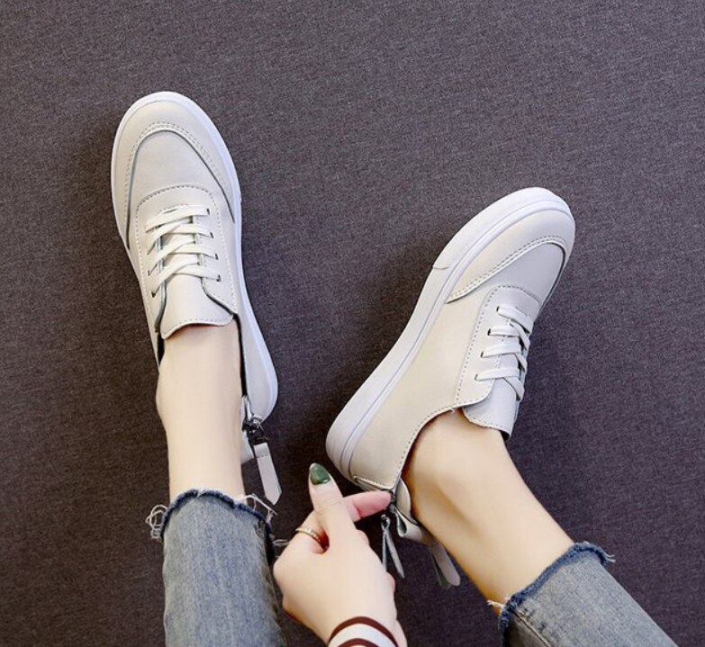 Kvinnor fritidsskor bekväma vita nude sneakers snörning delat läder flickor casual dragkedja plattor skor