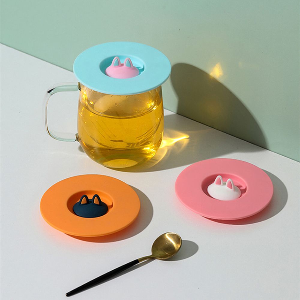 Durable, non-toxic, reusable coffee mug with sealed cover and anti-scalding suction cup lid.