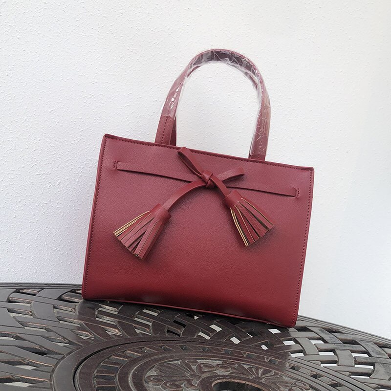 Gaohe europeu e americano bolsa de comércio exterior bolsa feminina outono e inverno nova fronteira bolsa borla arco pequeno quadrado ba