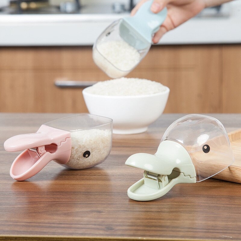 Forma de cabeza de pato creativa con cuchara de arroz transparente de plástico, Clip sellado, Dipper de agua para el hogar, cuchara bonita de pico de pato