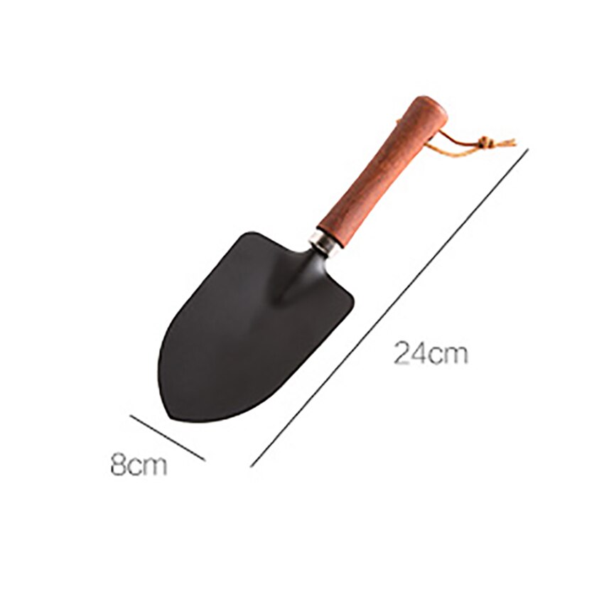 Trähandtag liten spade balkong plantering blommor ogräsrensning trädgårdsredskap hushåll köttiga krukor lös jord järn utgrävning spade