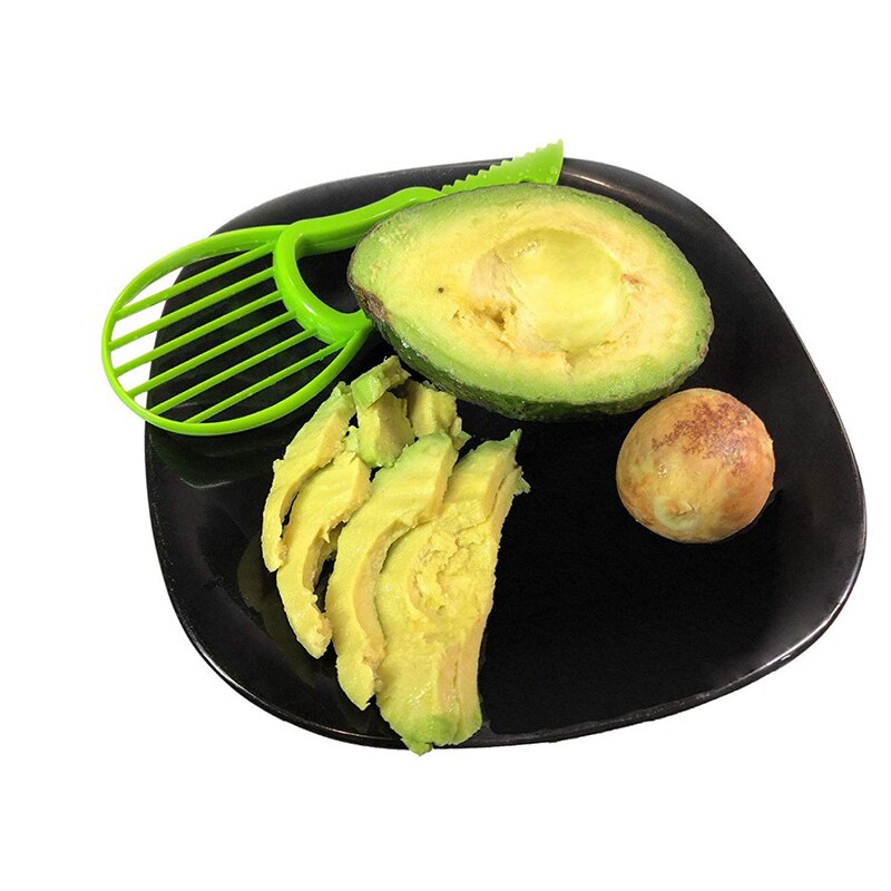 Krajalnica robić awokado obieraczka robić cięcia dzieli owoce doły szufelka narzędzia kuchenne Zielony