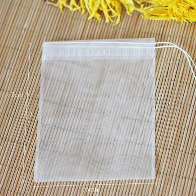 100 st/lot tom tepåse nylonmaterial tepåsar med snöre läka tätning filterpåse papper för ört löst te 5 storlekar: 6 x 7cm