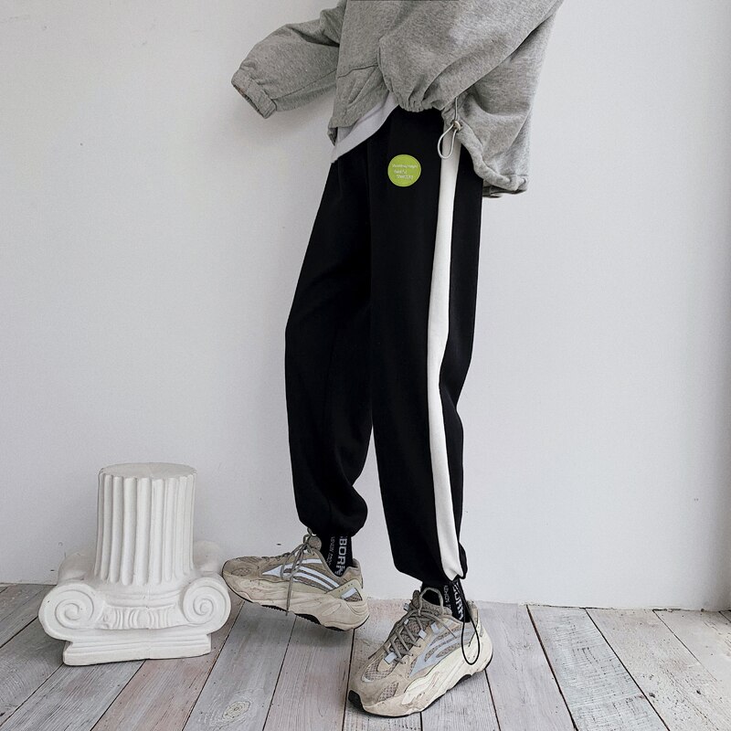 Verkkarit miesten hittivärit rento lenkkeilyhousut miesten katuvaatteet villi löysät hip hop suorat housut miesten verryttelyhousut