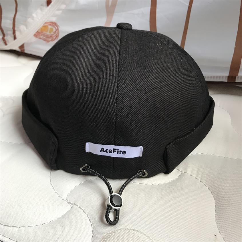 Kiinteä kiristysnyöri pipo reunaton lippalakki vintage retro leon satama satamalaituri hattu rullattu ranneke kallo merimies pyöräilijä lippikset kesä ulkona