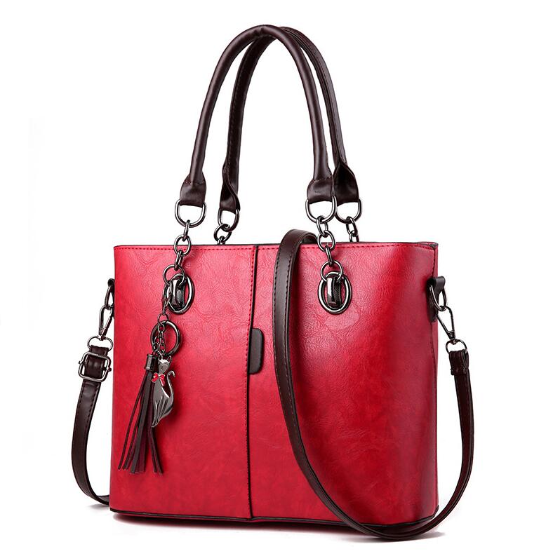 Yogodlns mujer de invierno bolsos de mano de cuero de color con borla y borla colgante de gato: Wine red