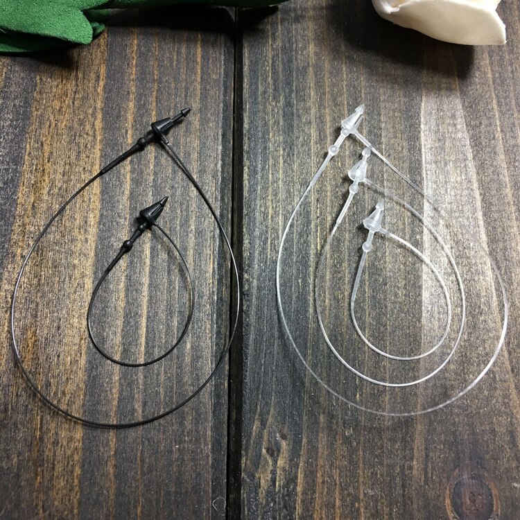 Lucchetti ad anello in plastica perni di bloccaggio a scatto in plastica etichetta di sicurezza abbigliamento etichette per etichette elementi di fissaggio perni ad anello indumenti etichetta sigillo