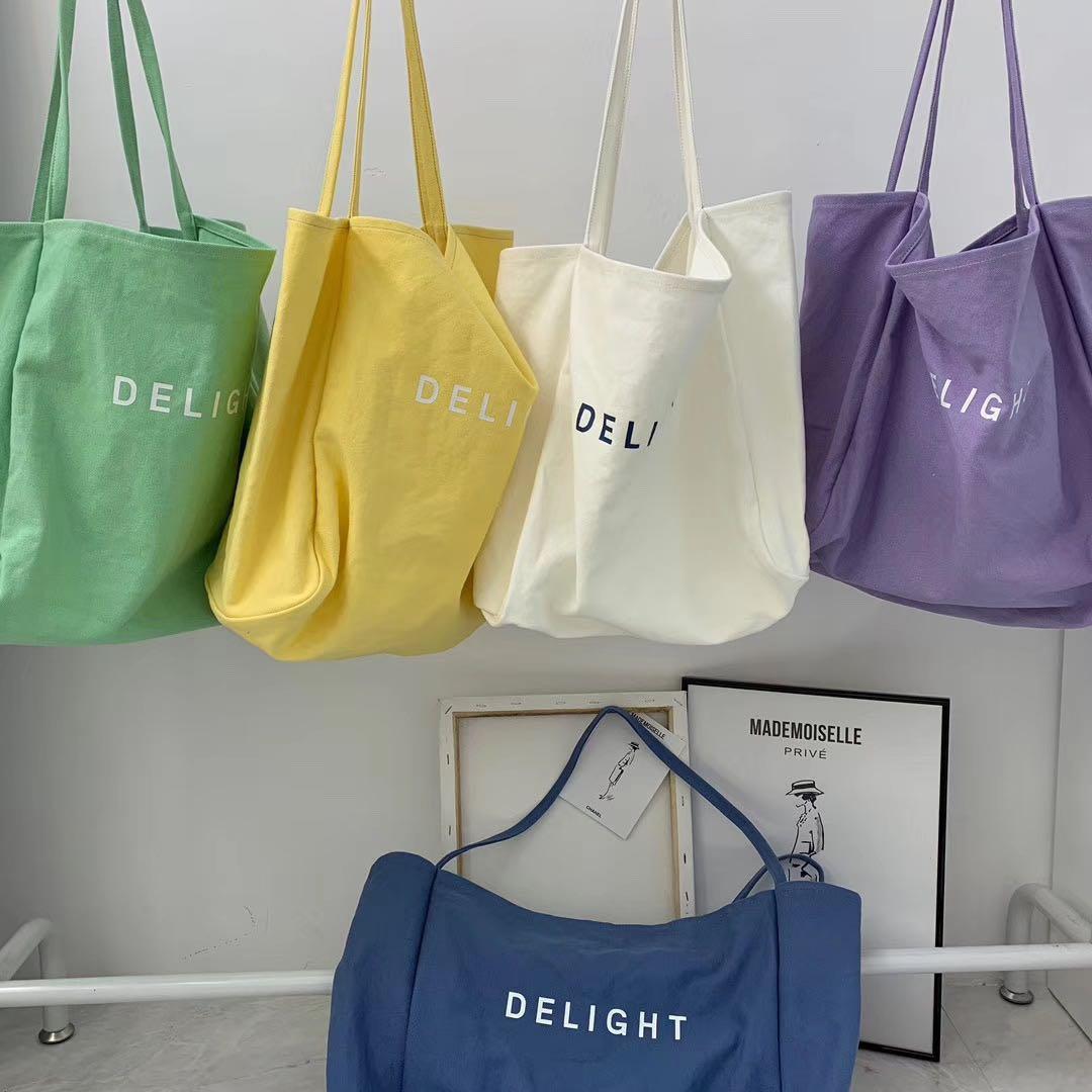 Einfache damen-schultertasche aus canvas, großes fassungsvermögen, umweltfreundliche einkaufstasche in bonbonfarben, lässige tragetasche für damen.