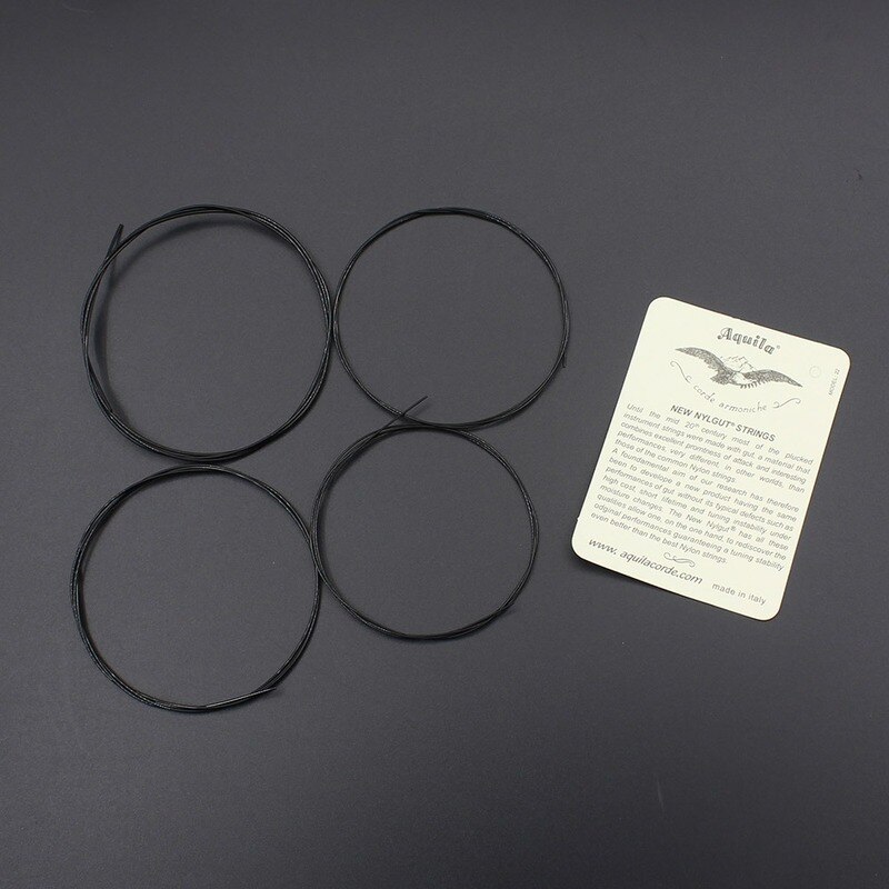 Musta/valkoinen nylon ukulele kielet kestävät tarvikkeet kielisoittimelle 4 kpl/setti