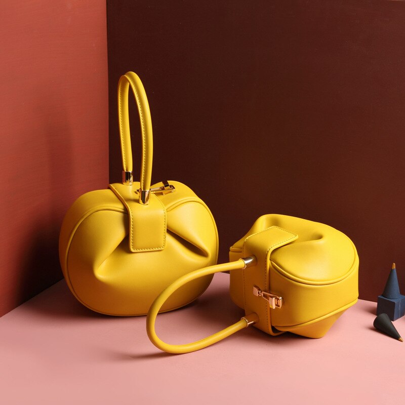 Bag girl leather bag European and American retro niche wonton hand dumpling wonton bag: yellow small