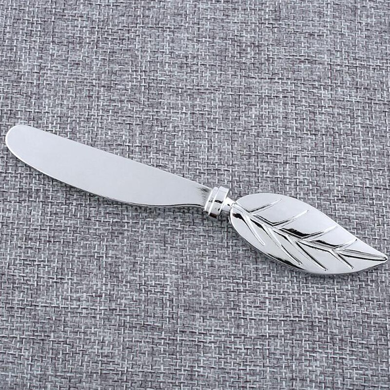 Bordhåndtak blad ost brød smør kniv synke legering herre smør dessert syltetøy ost skjærer smøre tallerken frokost verktøy: misligholde tittel