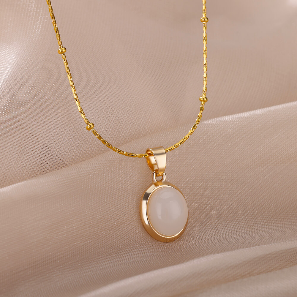 Ovale ketting met opaalsteen voor dames, gemaakt van roestvrij staal met een gouden ovale stenen hanger, ideaal voor een bruiloft.