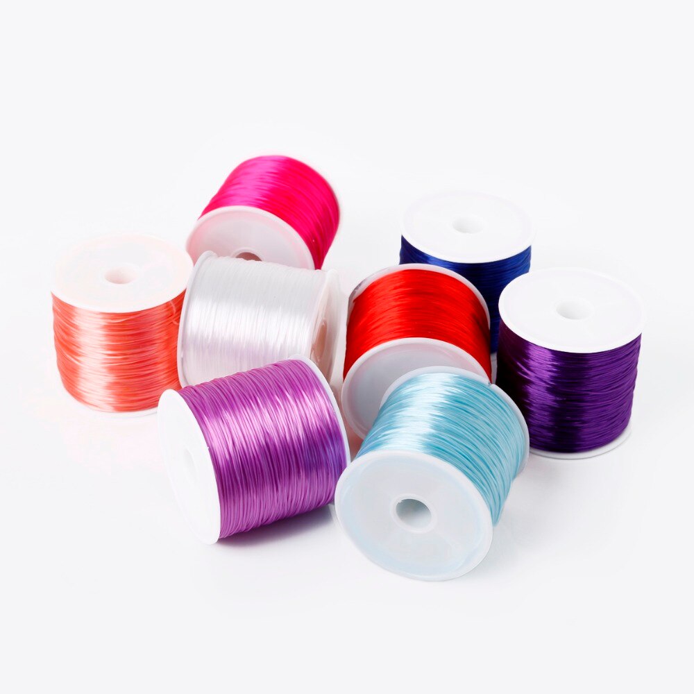 1 rollo/60 M 0,7mm hilo elástico línea de cristal redonda cable elástico de goma de Nylon para hacer joyas pulsera de cuentas 14 colores