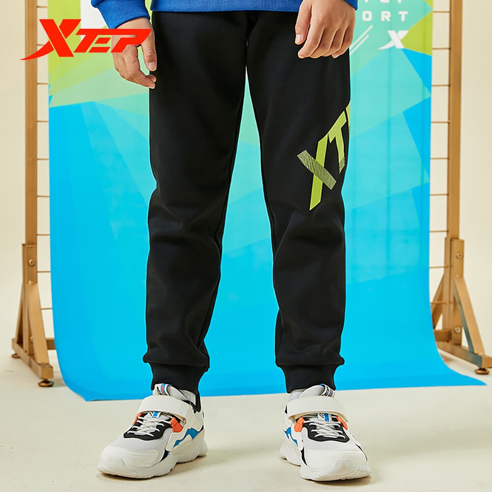 Spodnie dziecięce Xtep 2020 jesienne i zimowe spodnie chłopięce plus kaszmir ciepły tendencja zwykły spodnie sportowe 680426639028