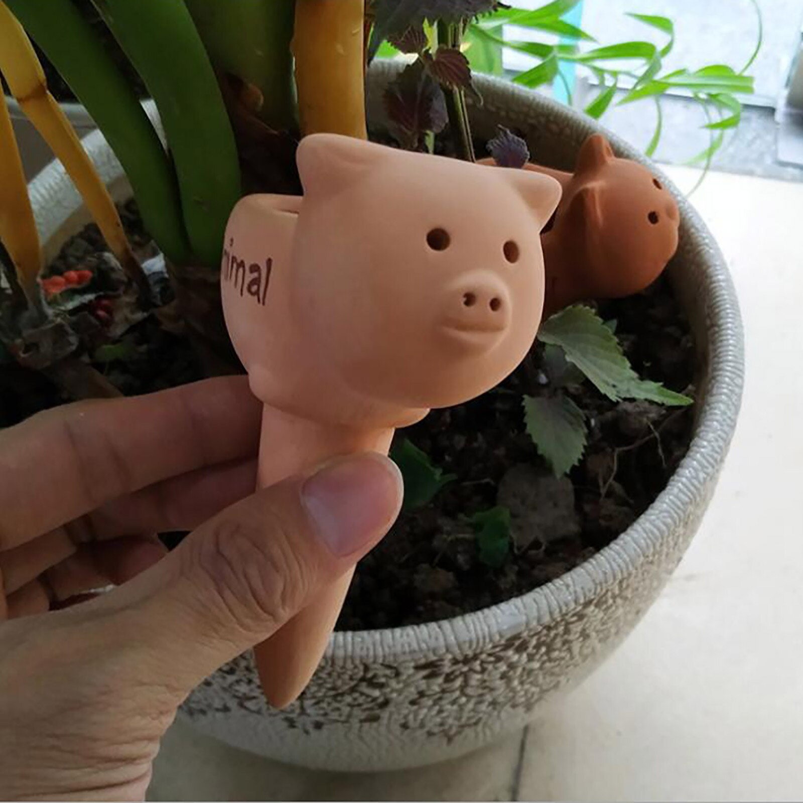 Strumento automatico contagocce per irrigazione in terracotta per piante cartone animato regolabile 12*8.5*5cm argilla per piante da interno ed esterno