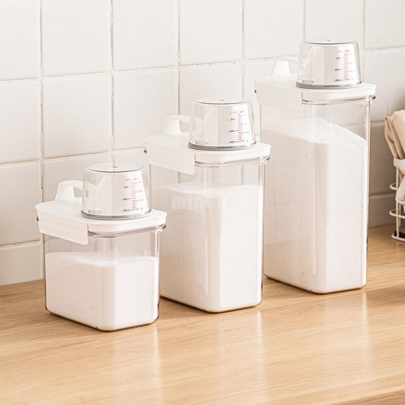 Förvaringslåda för hushållstvättmedel med måttbägare genomskinlig plastbehållare för tvättmedel med hällpip
