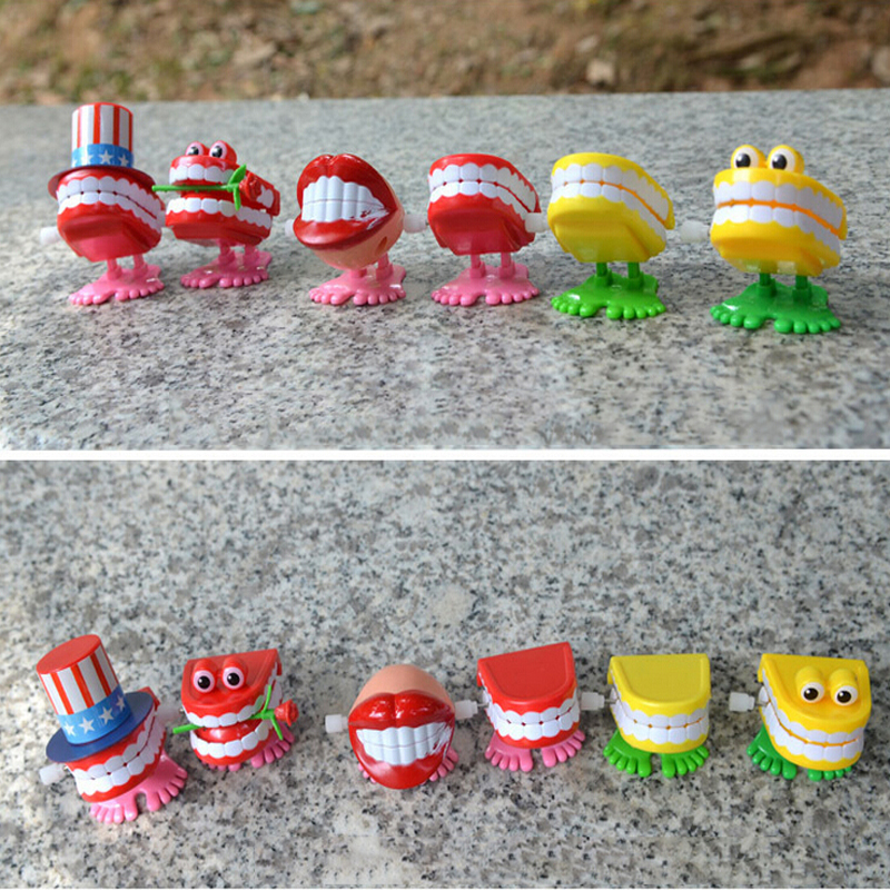 Foråret wind-up jump tand tandlegetøj dental wind-up dejlige foråret plast legetøj jump tænder kæde til børn