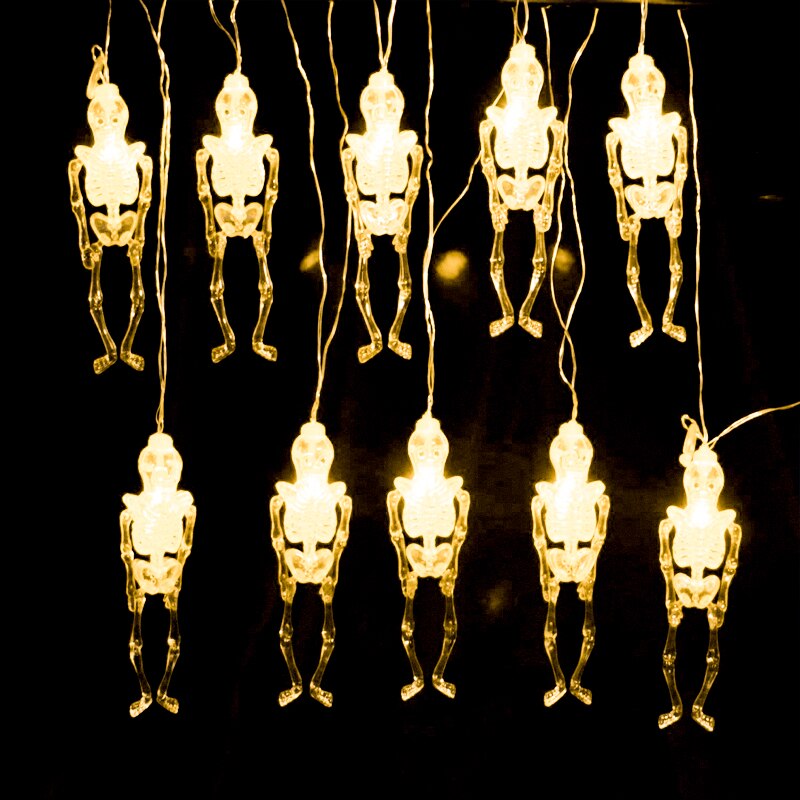 Halloween lichtsnoer met 10/20 led-lampjes, een lichtsnoer met led-lampjes, een pompoen, een skelet, een bot, een spook, een vleermuis en een spin.