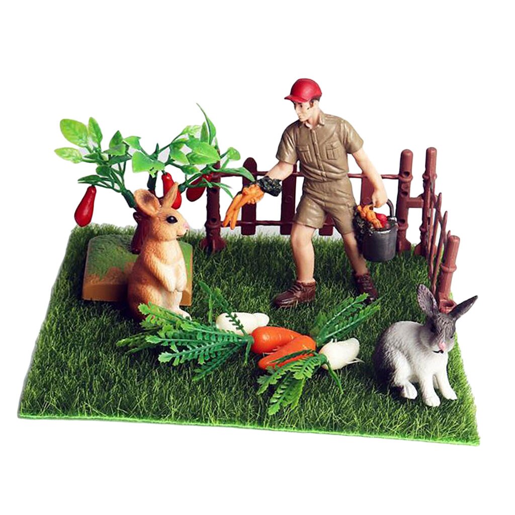 Miniatur-mikrolandschaftsdekoration mit kaninchen und karotten (nahaufnahme)