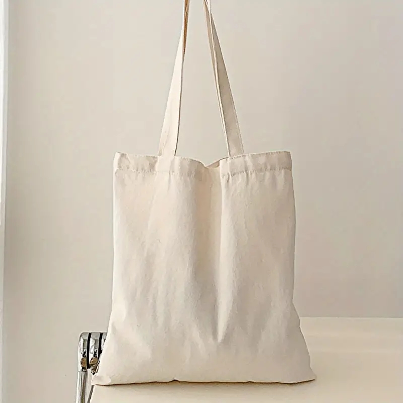 Einfache und lässige einfarbige Segeltuch-Material-Handheld-Umhängetasche für Damen mit großer Kapazität zum Einkaufen und Reisen: Beige