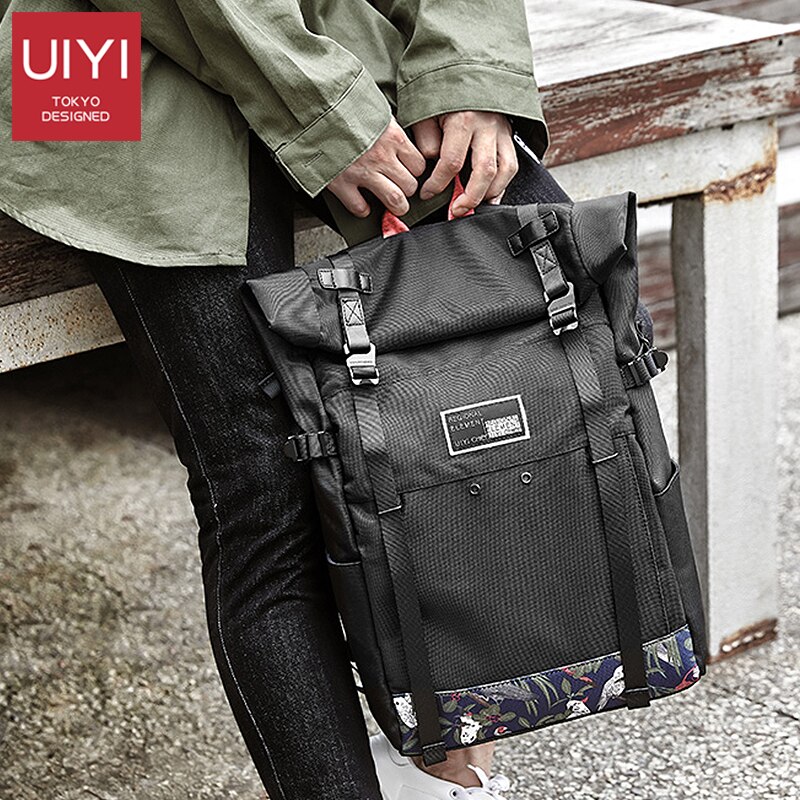 UIYI marca Coreana tampa do rolo de 15 polegada de viagem saco de escola mochila de esportes casuais saco dos homens laptop mochila mochilas à prova d' água