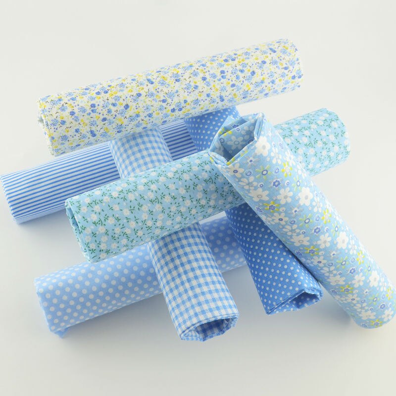 Boekenweef katoenen stof lichtblauwe kleur diverse fat quarter kussen quilten meter naaien textiel weefsel patchwork gordijn