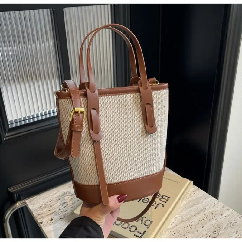 2025 polyvalent PU toile seau épaule et sacs à bandoulière Simple décontracté sens du luxe rétro sacs à main pour les femmes