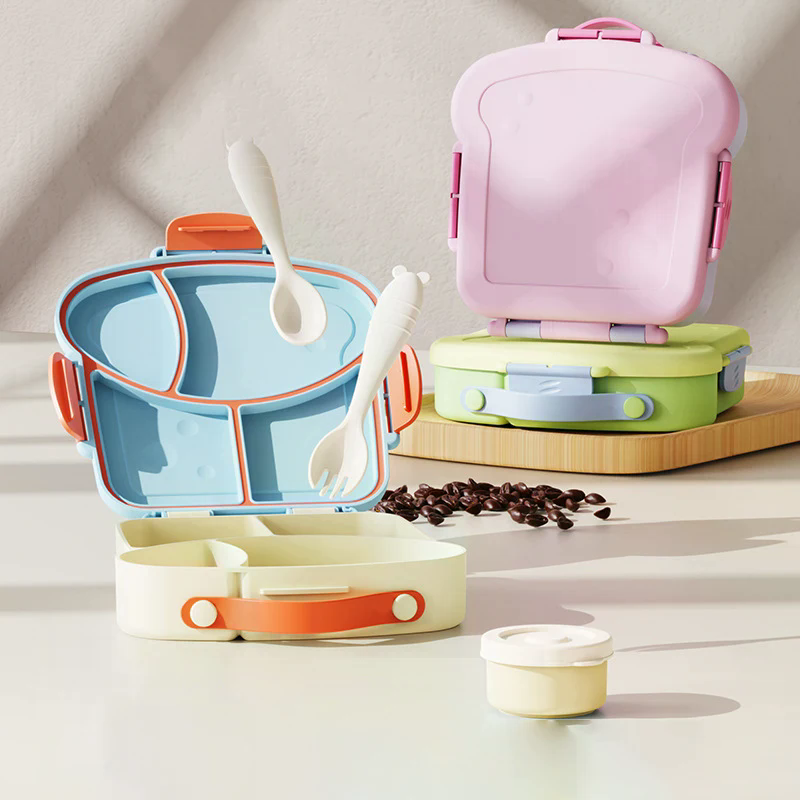 Uroczy plastikowy pojemnik na obiad z przegródkami, kreskówkowy pojemnik na jedzenie z pokrywkami, przenośny lunchbox bento dla uczniów i pracowników biurowych.