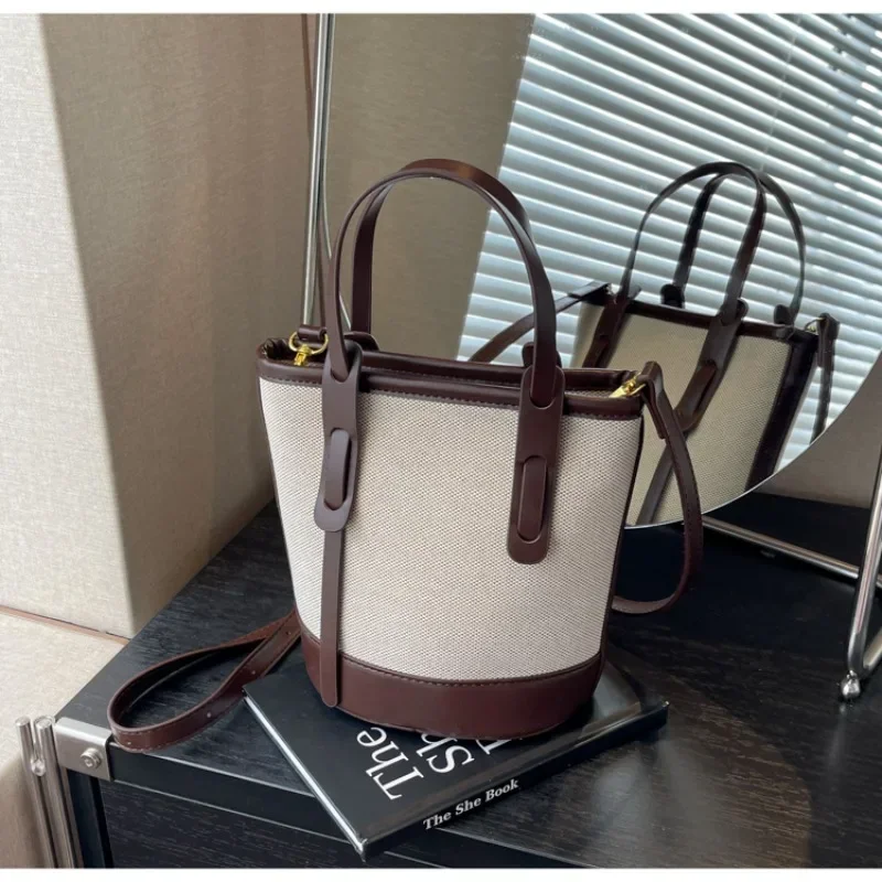 2025 polyvalent PU toile seau épaule et sacs à bandoulière Simple décontracté sens du luxe rétro sacs à main pour les femmes
