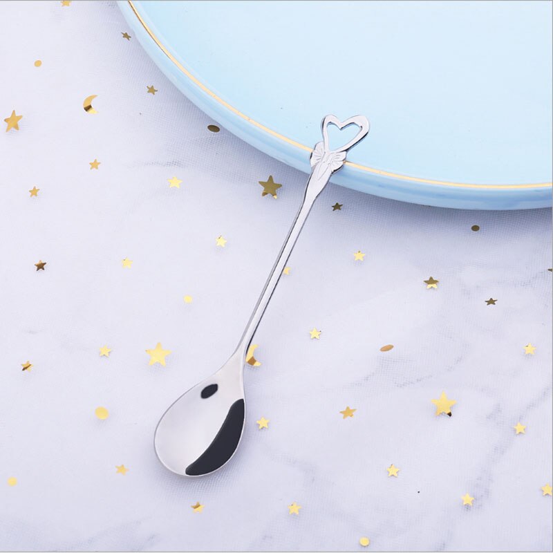 Japanese-style stainless steel coffee spoon dessert series set home kitchen rose four-leaf clover cartoon spoon: Silver hollow heart