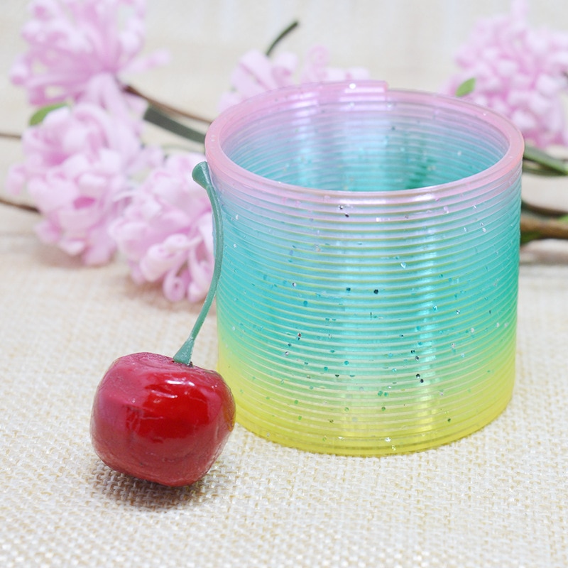 10 stuks magische plastic glimlach regenboog veer kleurrijke cirkel spoel voor kinderspellen grappige elastische ring educatief speelgoed