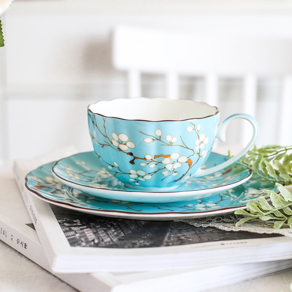 Grado Superior hueso taza de café de China conjunto británico a la hora del té por la tarde de porcelana tazas de té y platillos postre placa plana de de té