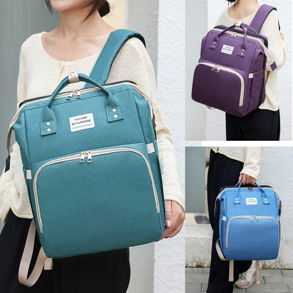 Bolsa de pañales para cama, de cuna, bolso de momia desmontable, impermeable, mochila de pañal de tela, almohadilla cambiante y ganchos