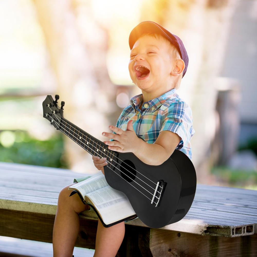 Kmise ukelele Soprano de juguete Musical, instrumentos para niños, 21 pulgadas ABS negro Uke con bolsa, cadena de púas