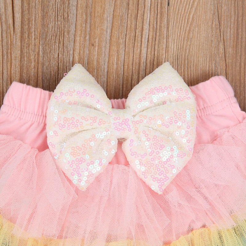 Härlig nyfödd flicka elastisk midja paljetter rosett tutu lager bodysuit kjol pannband 2 st prinsesstjejer regnbågskläder
