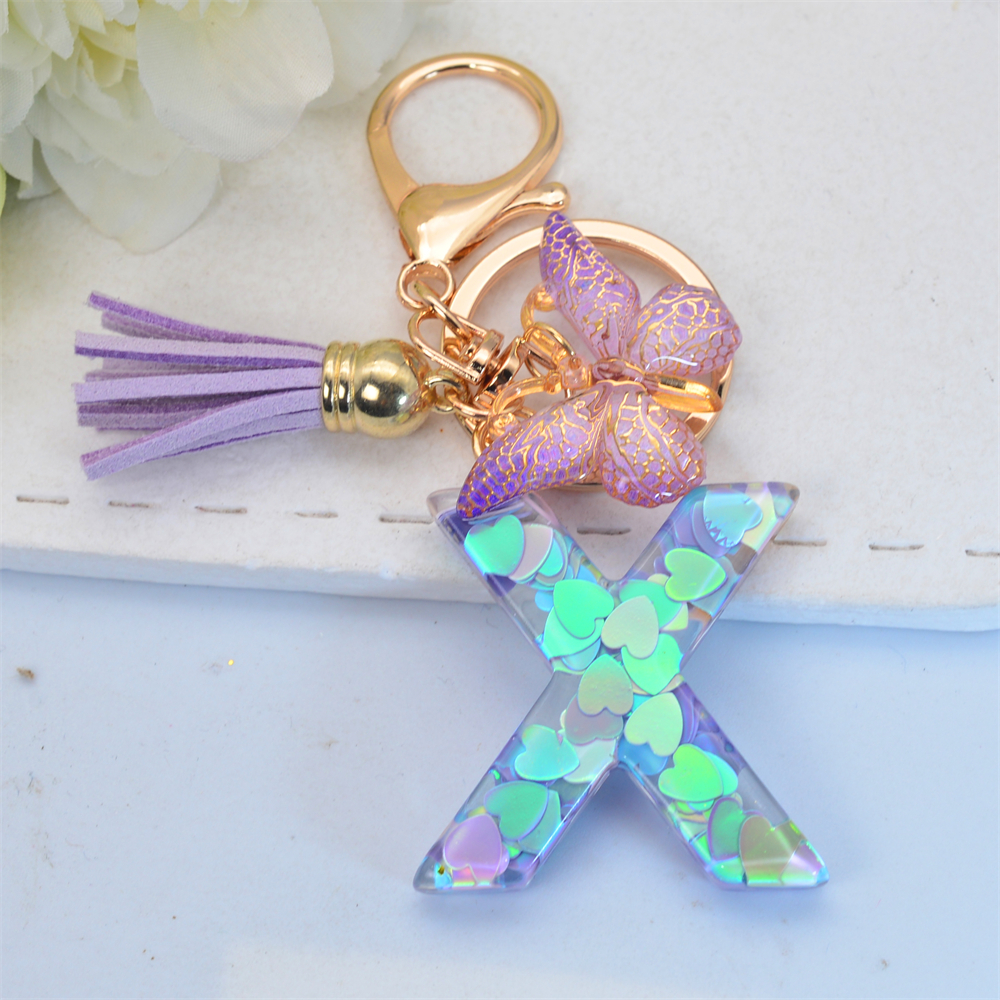 Exquisito llavero de resina brillante azul con 26 iniciales, llavero con colgante de borla de mariposa púrpura con letra de A a Z para mujeres y hombres, para parejas: Caqui oscuro