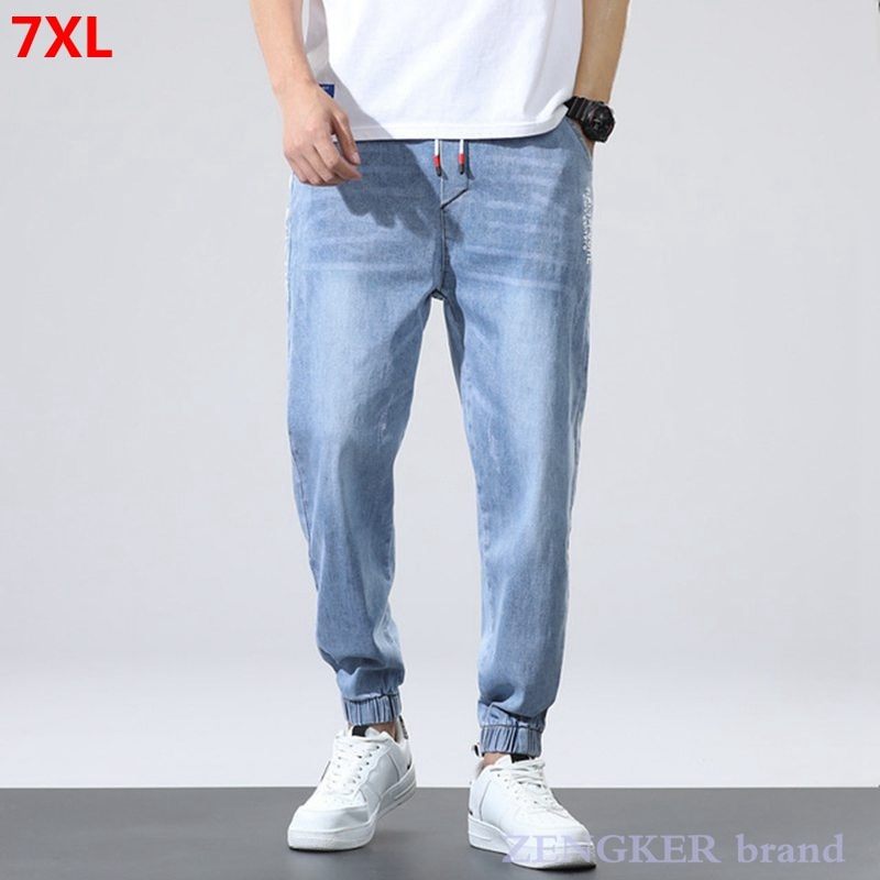 Forår 6xl jeans mænds elastiske lukkebukser løse mænds bukser plus størrelse jeans herrebukser 7xl