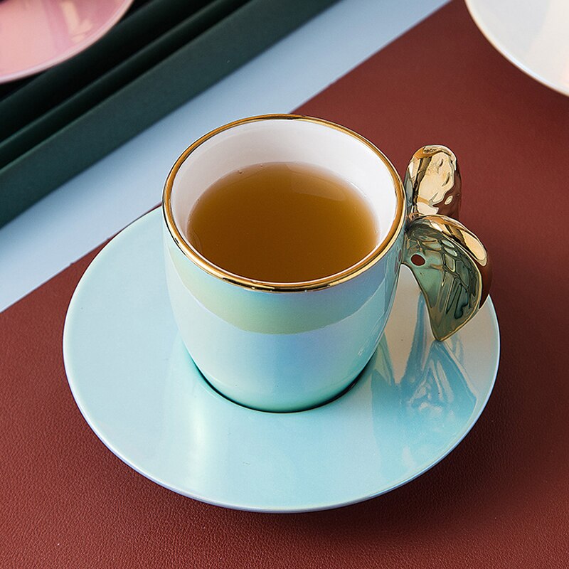 Nordycki kreatywny złoty anioł skrzydło kubek z talerzykiem porcelanowa filiżanka robić herbaty kawy zestaw uroczy prezent urodzinowy biała perła różowy niebieski kubek spodek