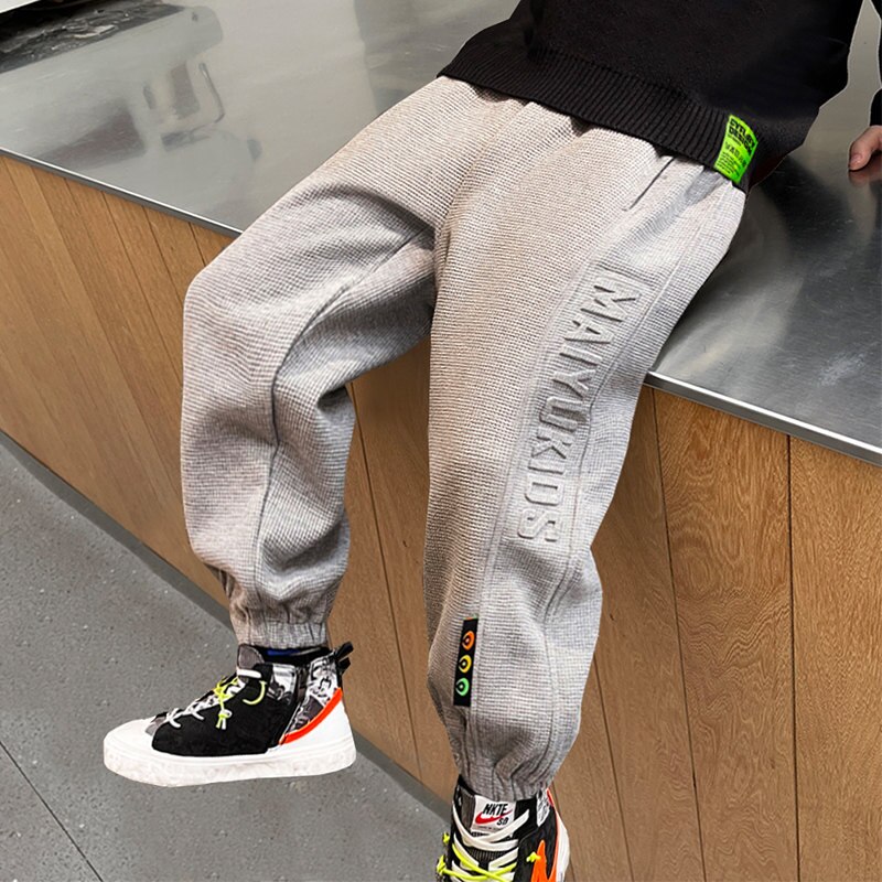 2022 primavera Casual lettera modello pantaloni bambini tinta unita Sport pantaloni lunghi allentati per bambini ragazzi adolescenti 5 6 7 8 9 10 11 12 14 anni