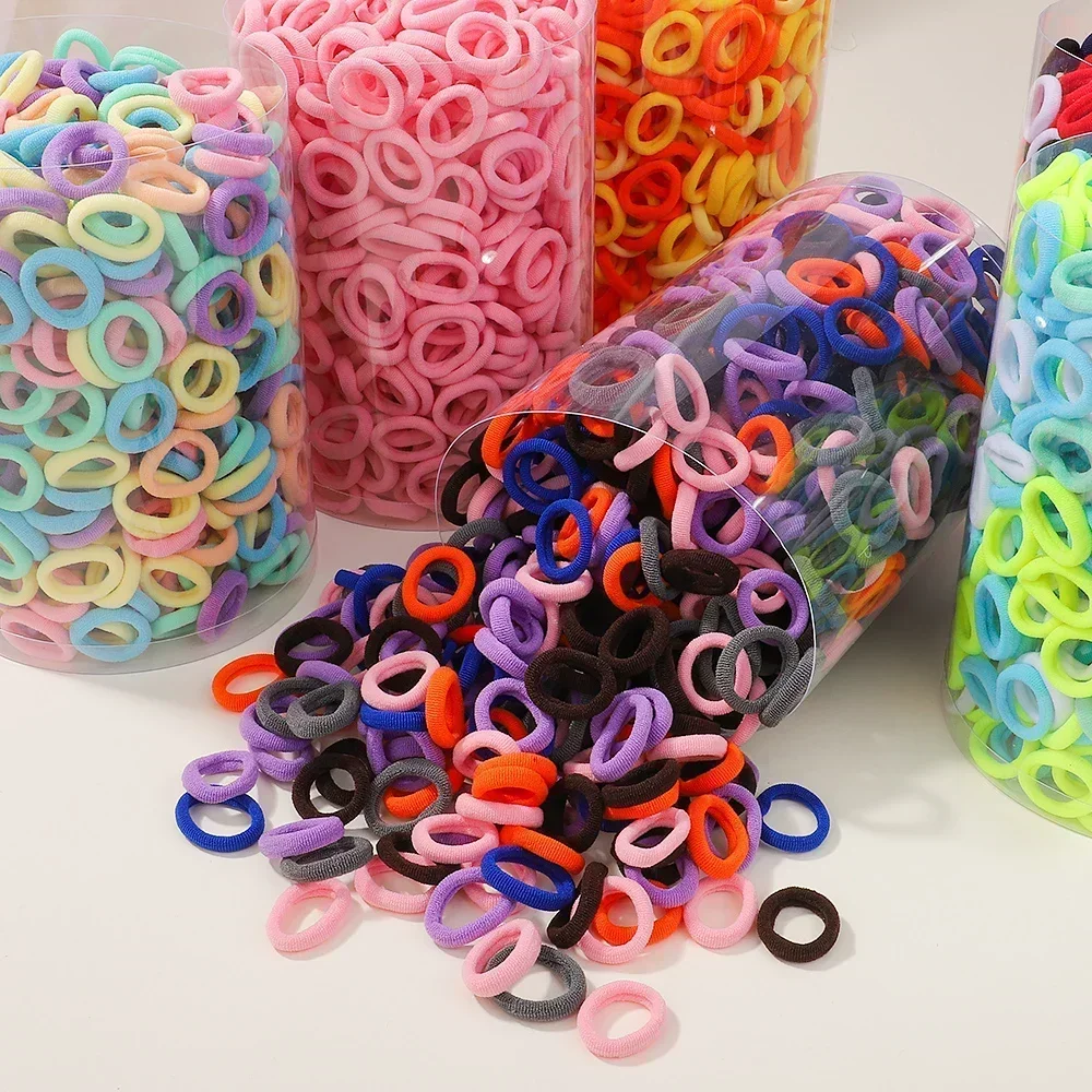 50/100/300 Uds Mini bandas elásticas coloridas para el cabello para niñas accesorios para el cabello diadema de nailon soporte para cola de caballo para niños adorno Scrunchie