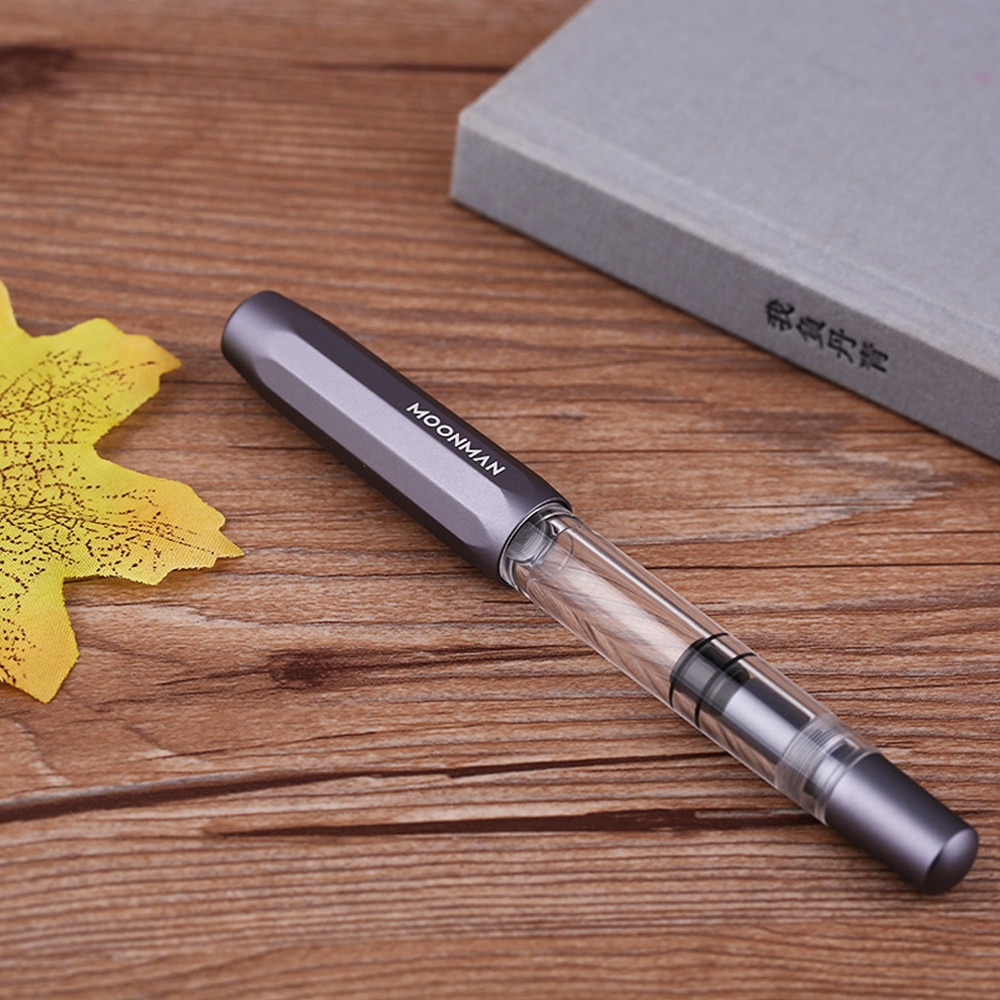 Pluma fuente de Metal Moonman T1 Piston de gran capacidad, pluma de tinta F Nib, caja Original